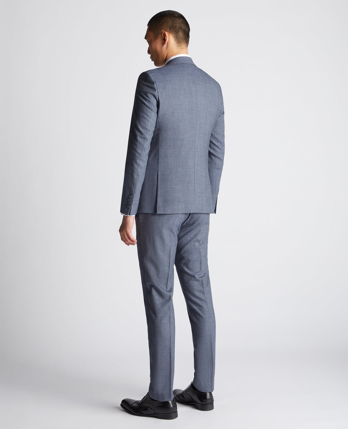 Man wearing a blue X-Slim Fit Wool Blend Mix And Match Suit Jacket