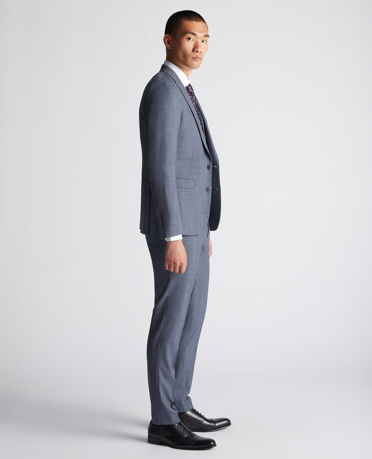 Man wearing a blue X-Slim Fit Wool Blend Mix And Match Suit Jacket