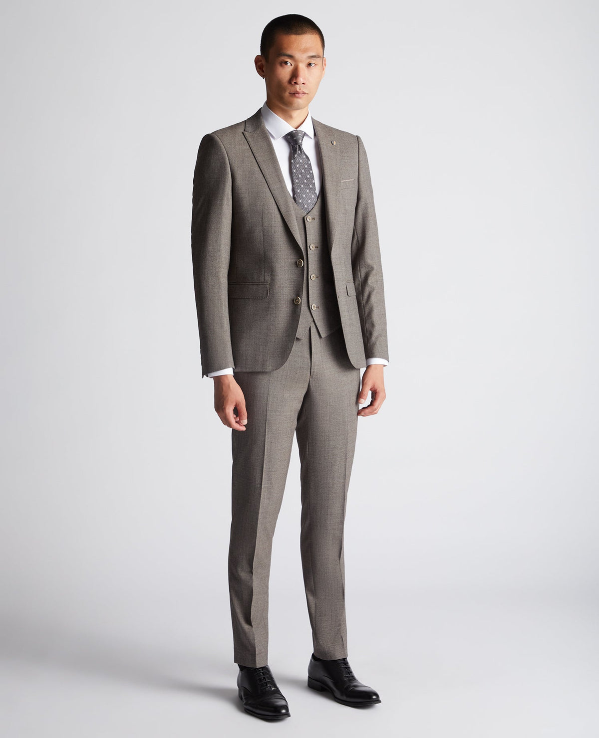 Man wearing a brown X-Slim Fit Wool Blend Mix And Match Suit