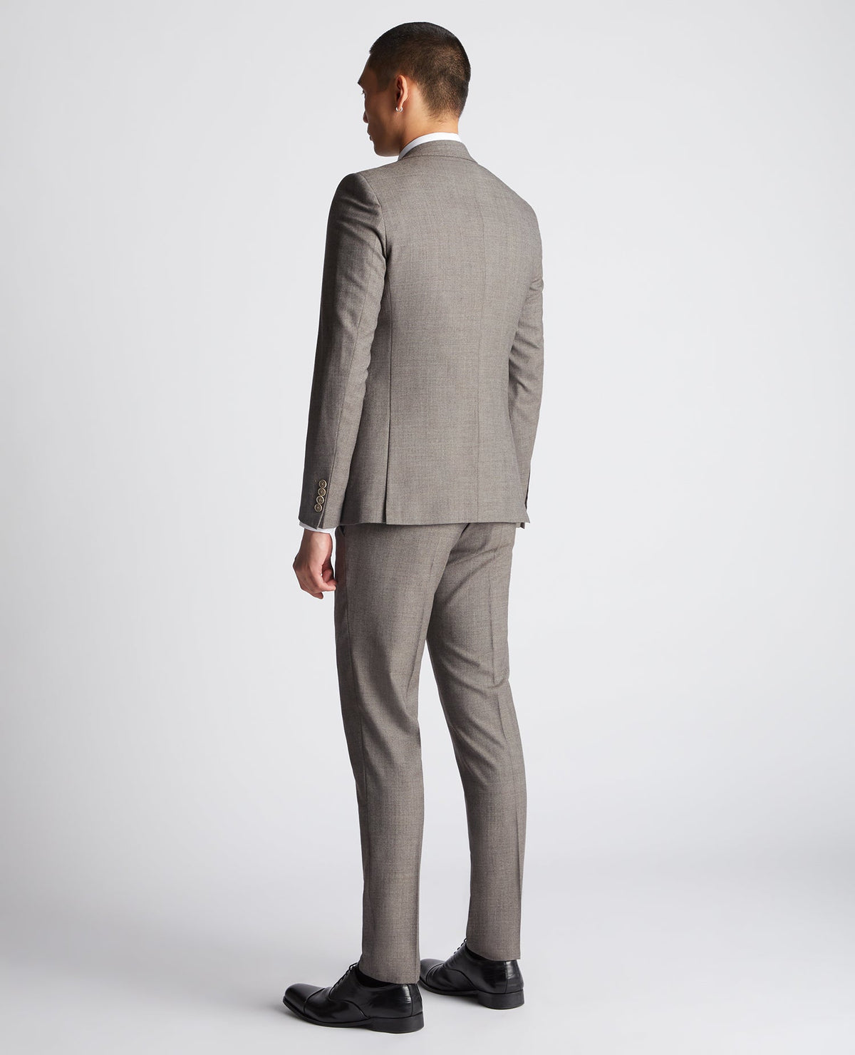 Man wearing a brown X-Slim Fit Wool Blend Mix And Match Suit