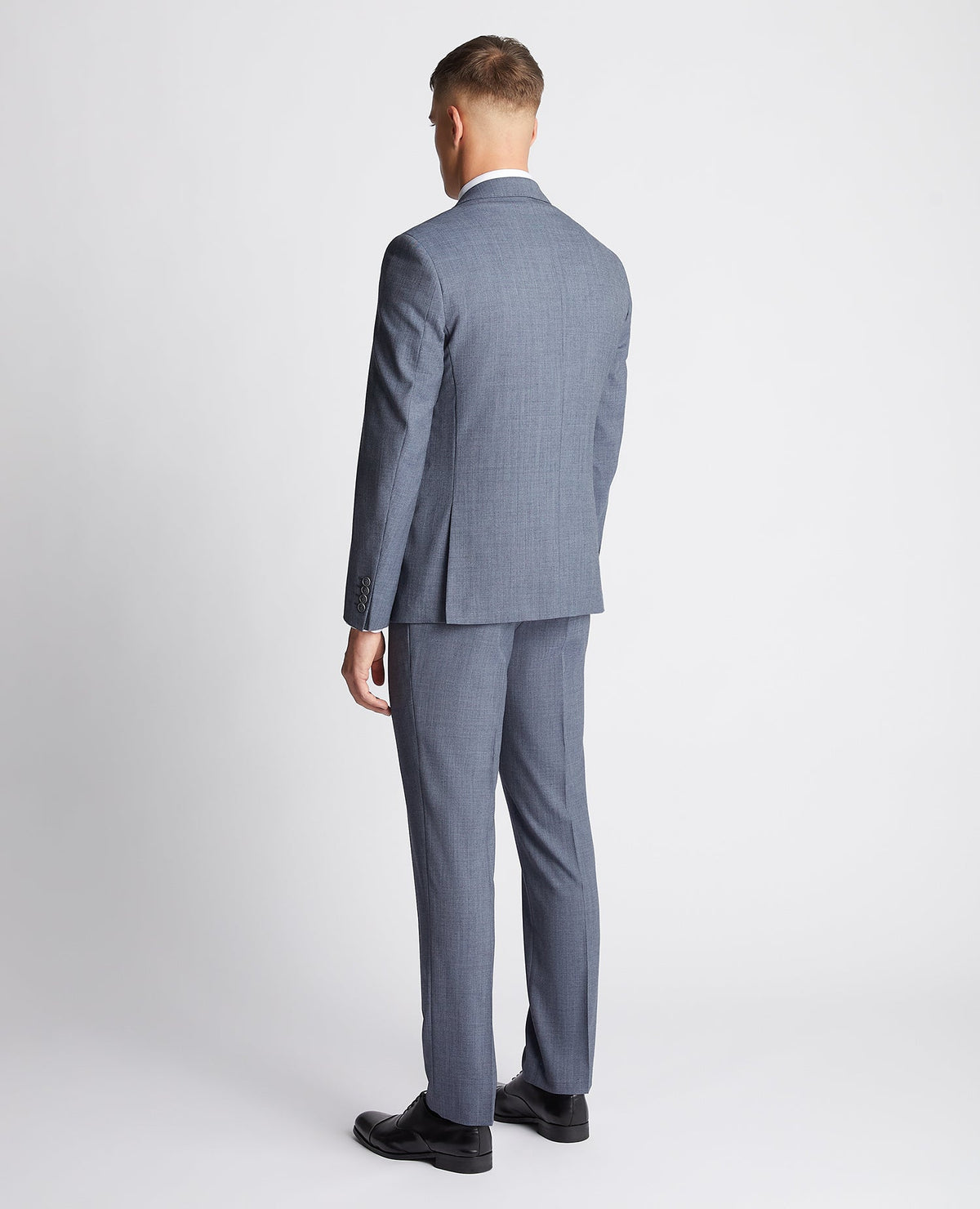 Man wearing a blue Tapered fit wool rich mix and match suit Jacket
