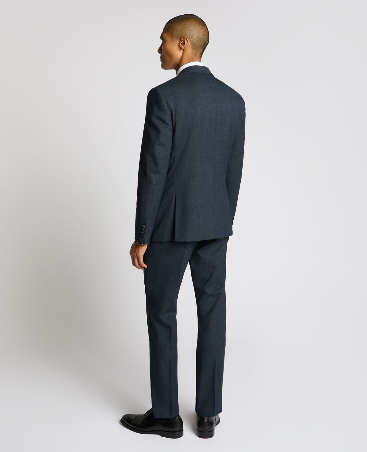 Man wearing a blue Slim Fit Wool Blend Suit