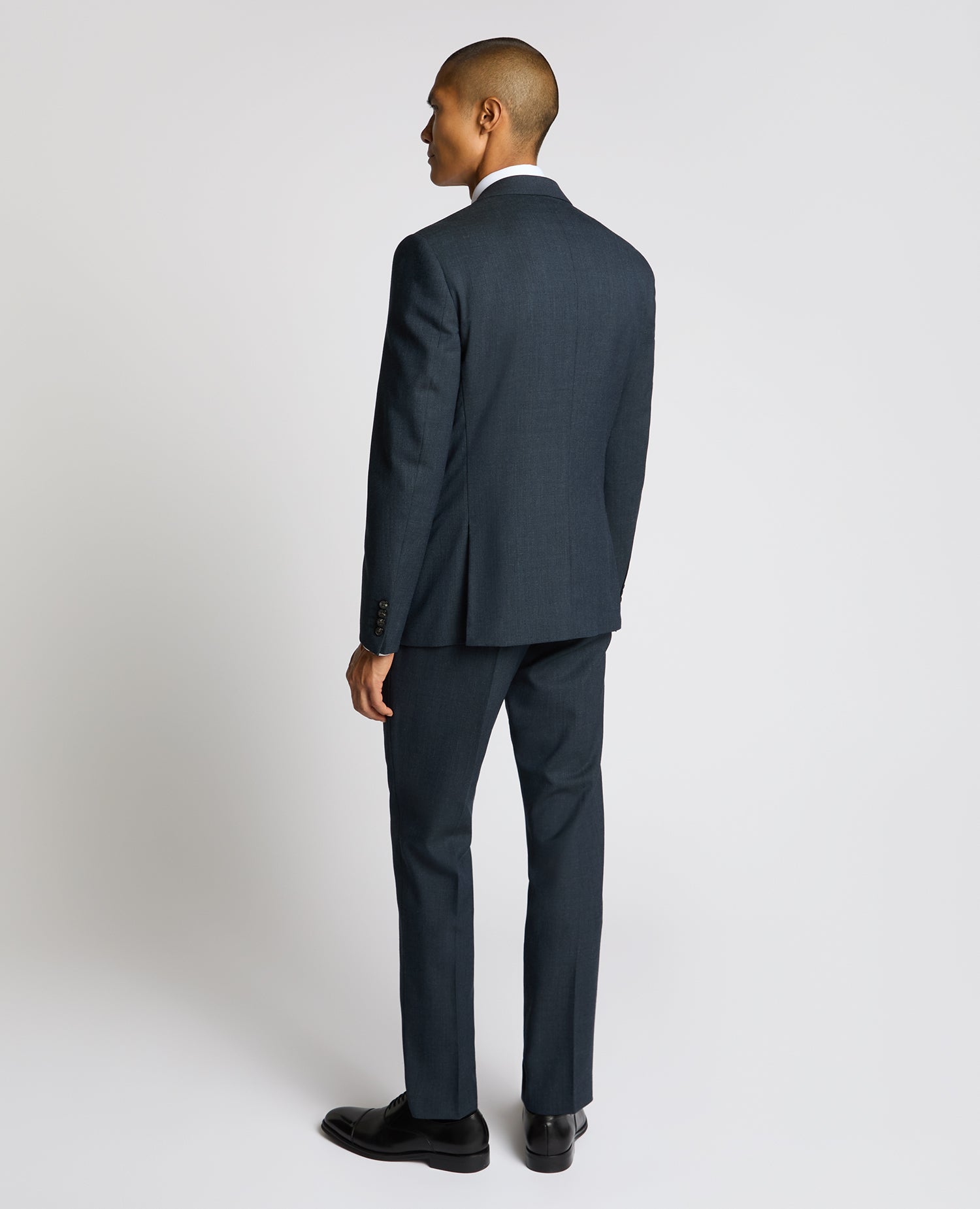 Man wearing a blue Slim Fit Wool Blend Suit