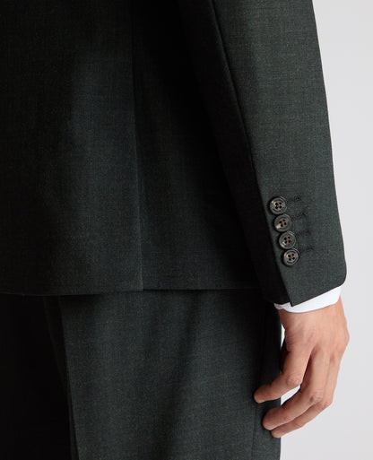 Man wearing a green Slim Fit Wool Stretch Suit