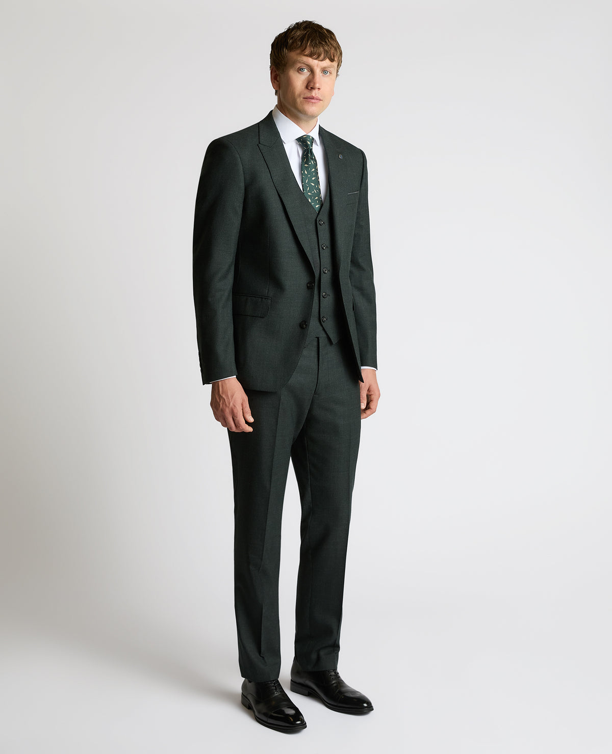 Man wearing a green Tapered Fit Wool Stretch Jacket