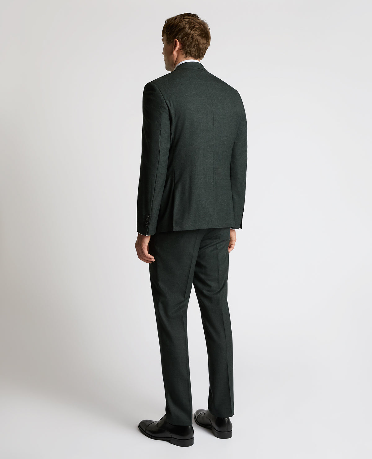 Man wearing a green Tapered Fit Wool Stretch Jacket