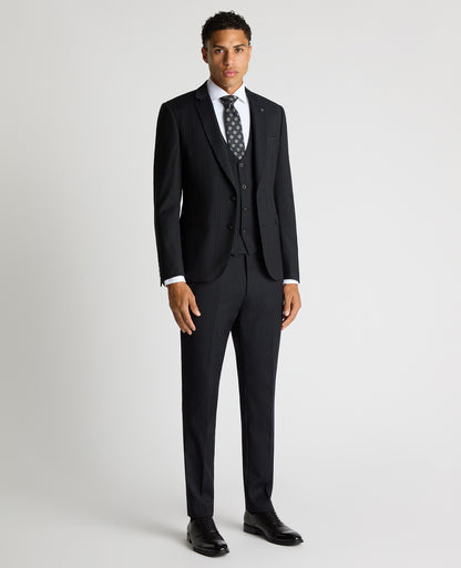 Man wearing a navy Slim Fit Pinstripe Wool Rich Suit