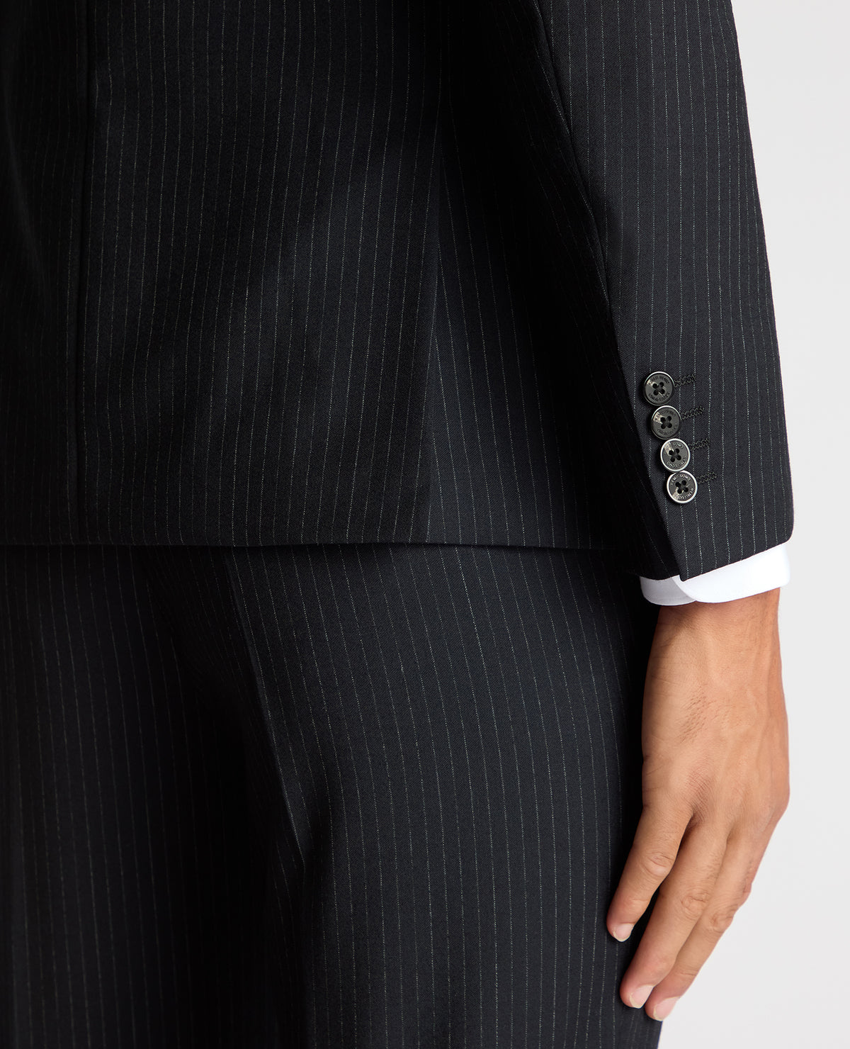 Man wearing a navy Slim Fit Pinstripe Wool Rich Suit