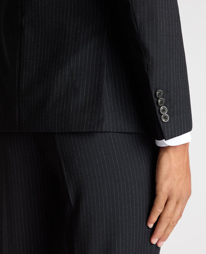 Man wearing a navy Slim Fit Pinstripe Wool Rich Suit