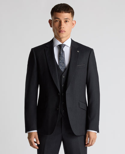 Man wearing a navy Tapered Fit Wool Rich Suit
