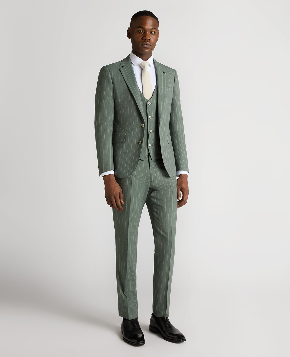 Man wearing a green Slim Fit Wool-Blend Mix and Match Suit Jacket
