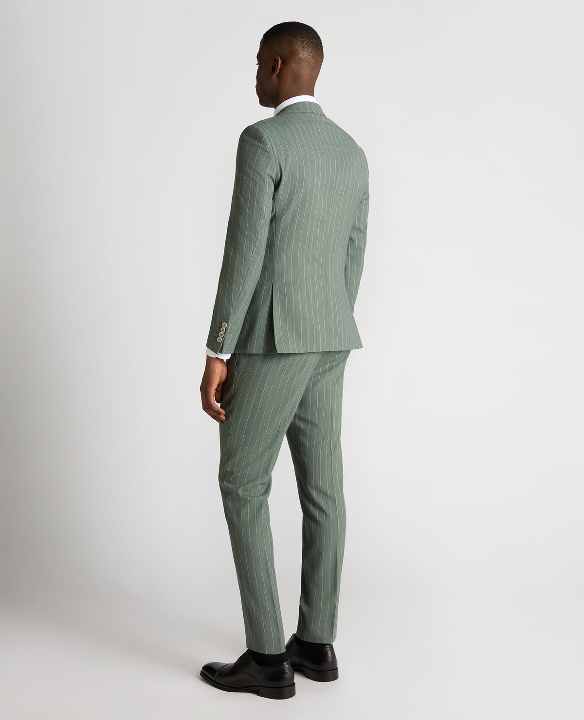 Man wearing a green Slim Fit Wool-Blend Mix and Match Suit Jacket