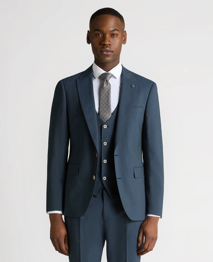 Man wearing a blue Tapered Fit Wool-Stretch Mix and Match Suit Jacket
