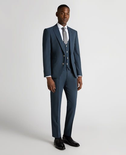 Man wearing a blue Tapered Fit Wool-Stretch Mix and Match Suit Jacket