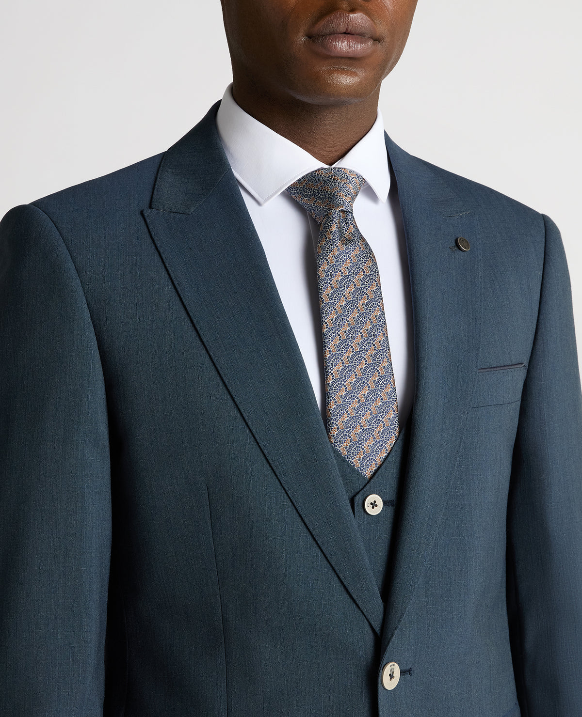 Man wearing a blue Tapered Fit Wool-Stretch Mix and Match Suit Jacket