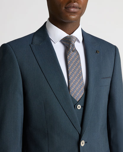 Man wearing a blue Tapered Fit Wool-Stretch Mix and Match Suit Jacket