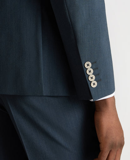Man wearing a blue Tapered Fit Wool-Stretch Mix and Match Suit Jacket
