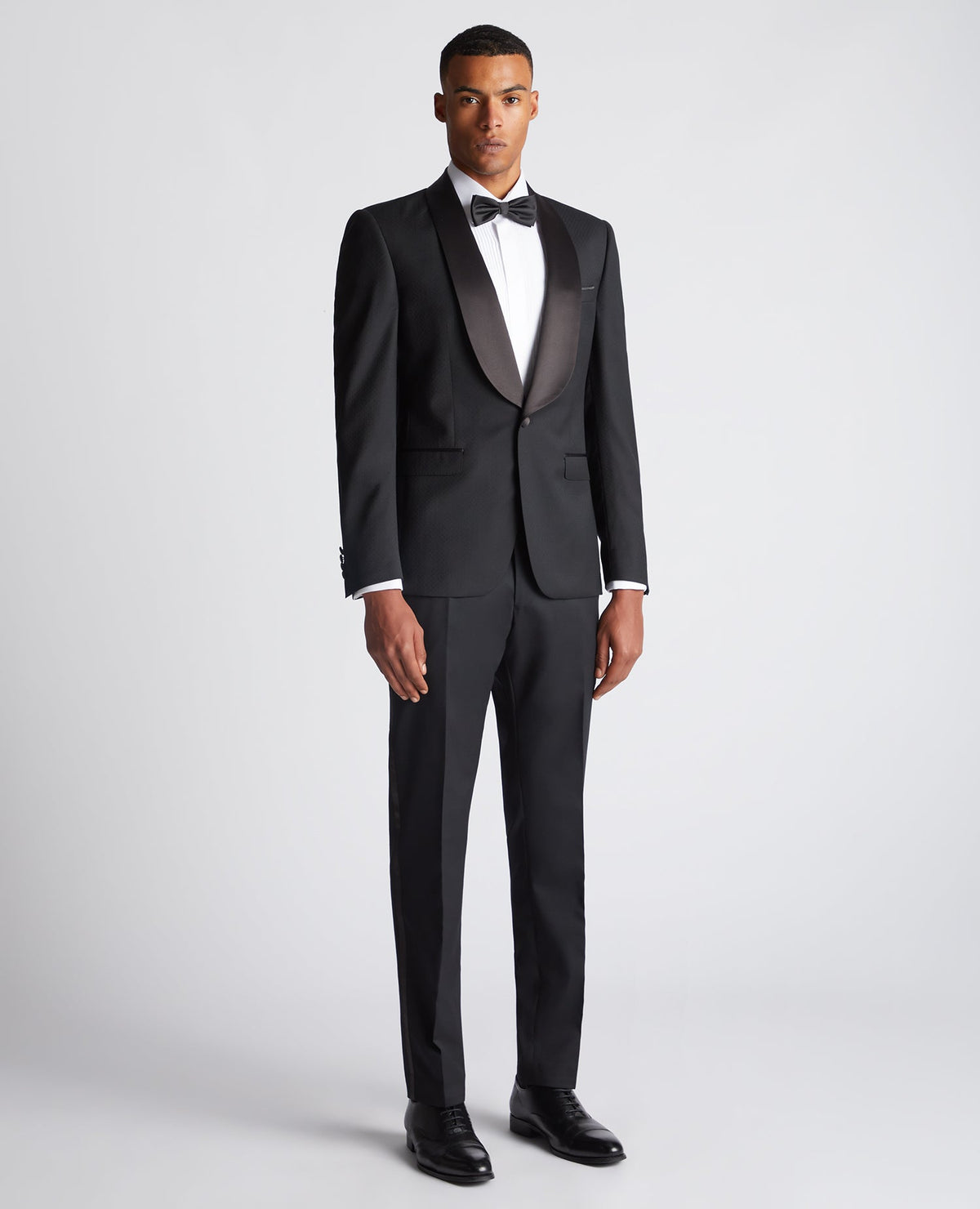 Man wearing a black Slim Fit Wool-Rich Mix and Match Suit