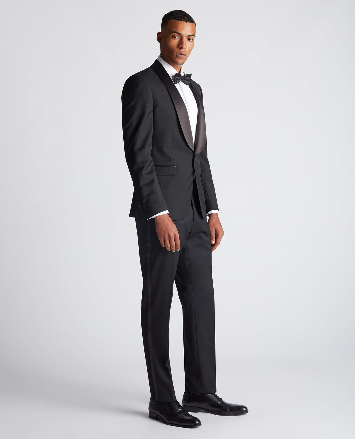 Man wearing a black Slim Fit Wool-Rich Mix and Match Suit