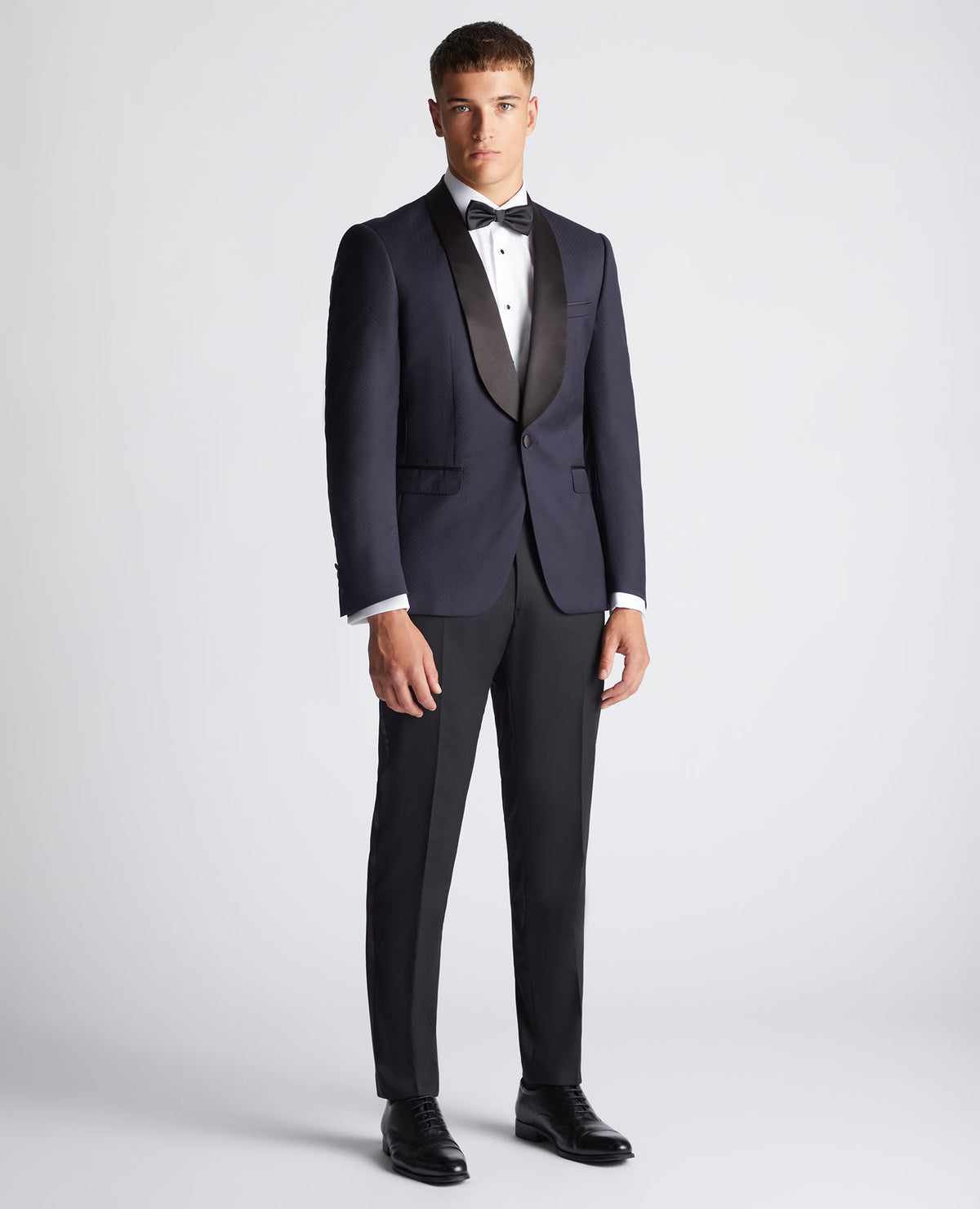 Man wearing a navy Slim Fit Wool-Rich Mix and Match Suit