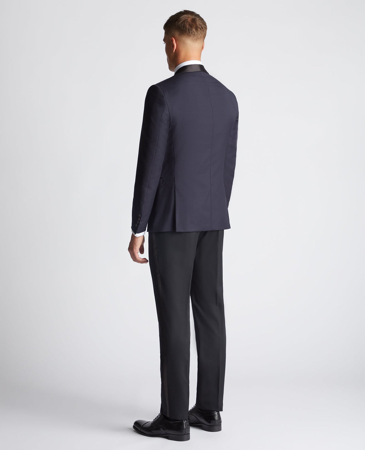 Man wearing a navy Slim Fit Wool-Rich Mix and Match Suit