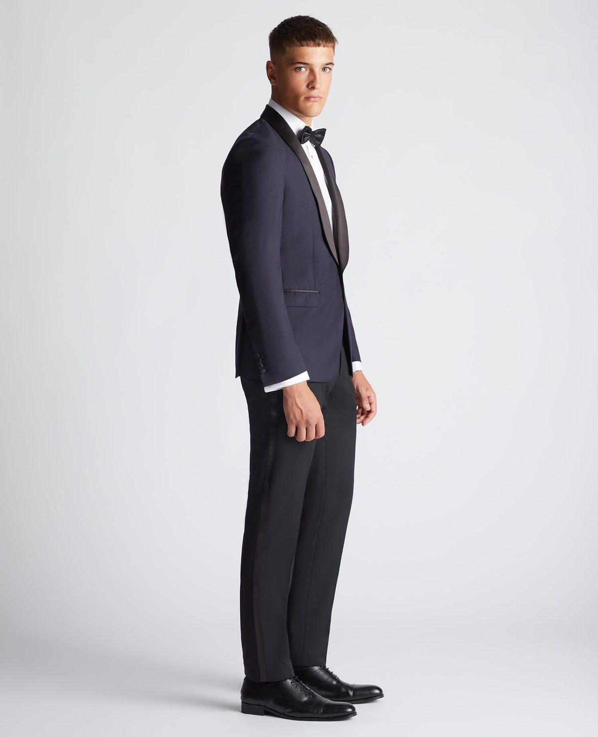 Man wearing a navy Slim Fit Wool-Rich Mix and Match Suit