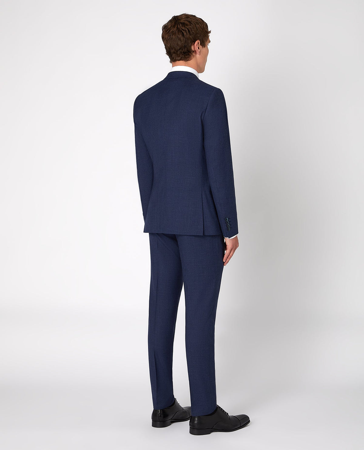 Man wearing a blue X-Slim Fit Wool Rich Mix and Match Suit Jacket