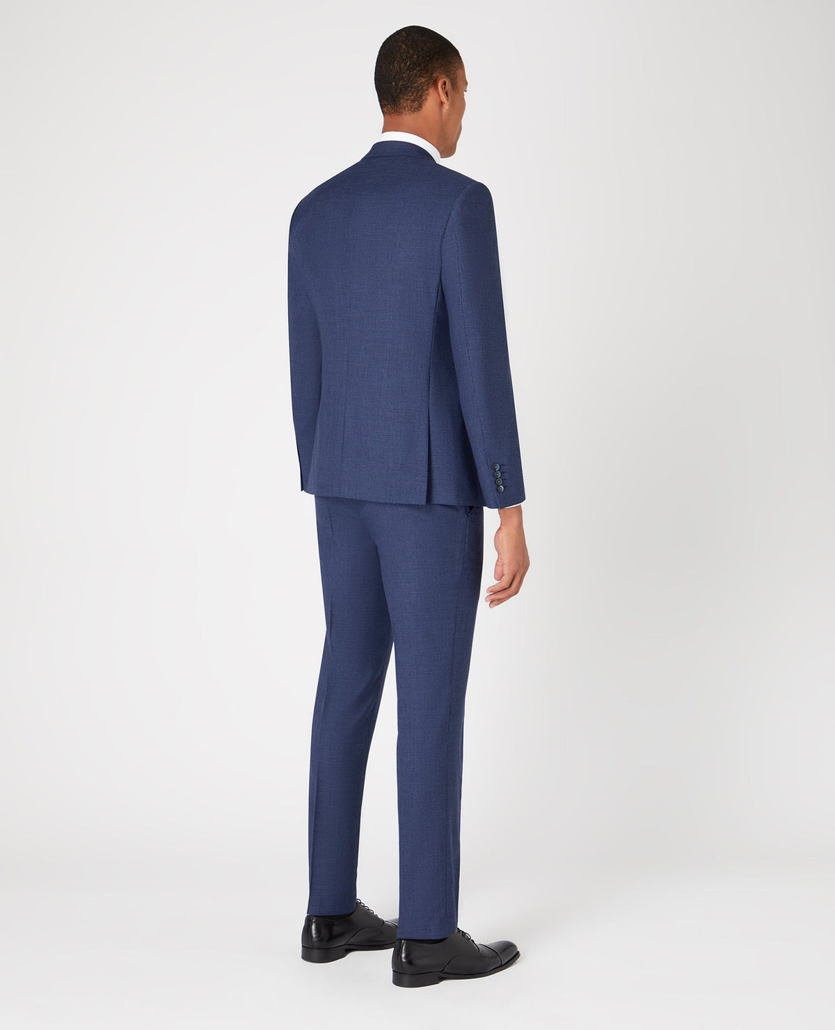 Man wearing a blue Tapered Fit Wool Blend Mix and Match Suit