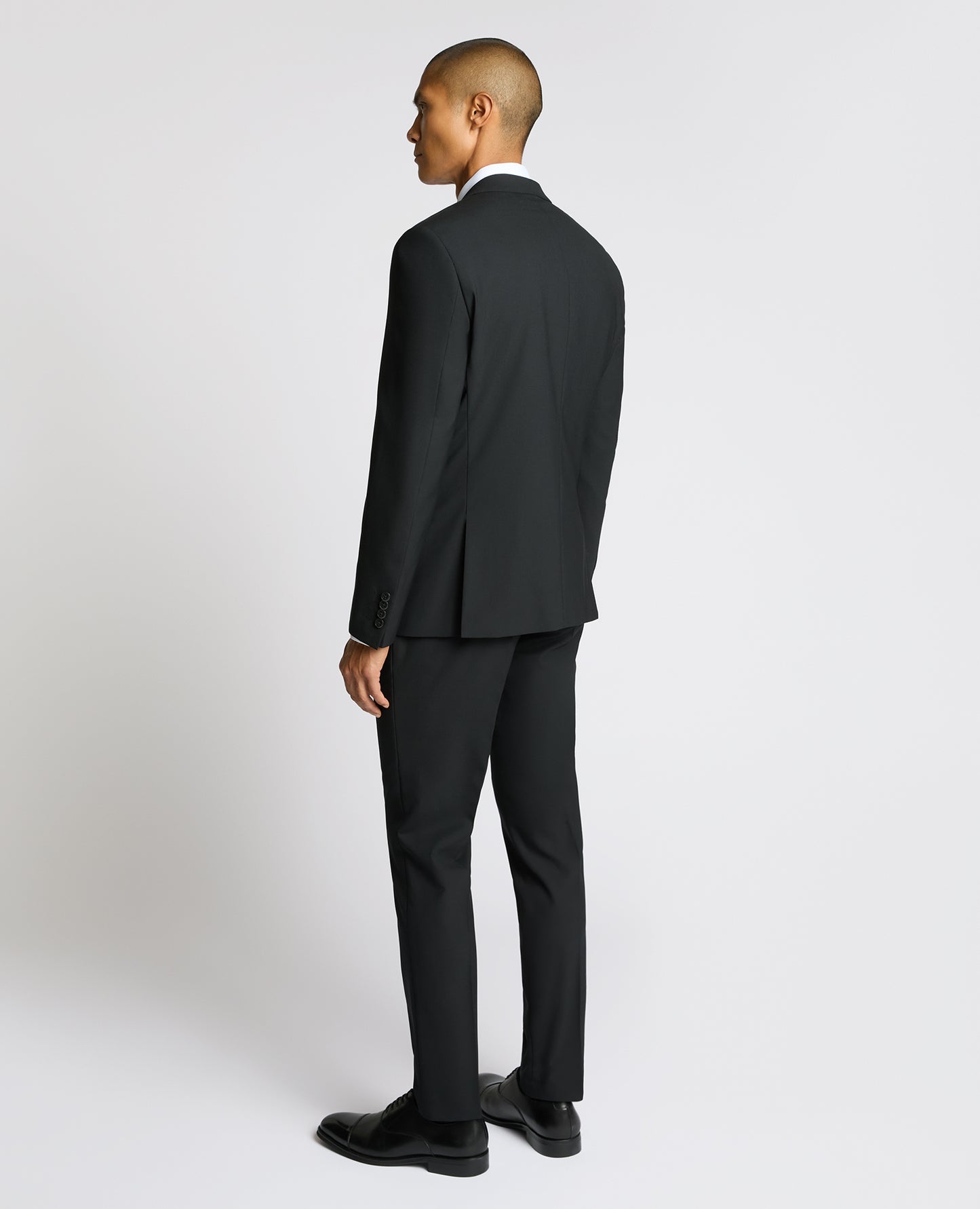 Man wearing a black Slim Fit Wool-Blend Suit