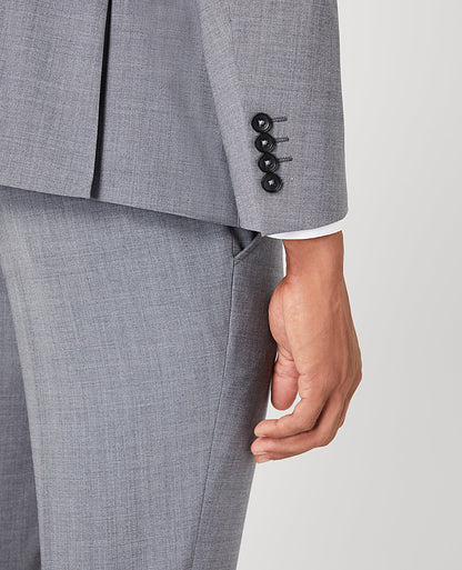 Man wearing a grey Tapered Fit Wool-Rich Stretch Mix and Match Suit Jacket