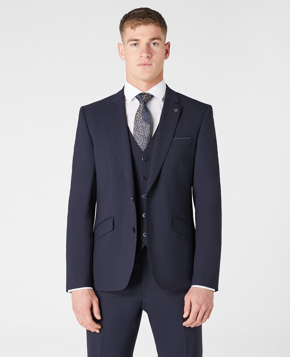 Man wearing a navy Tapered fit wool blend stretch mix and match suit jacket