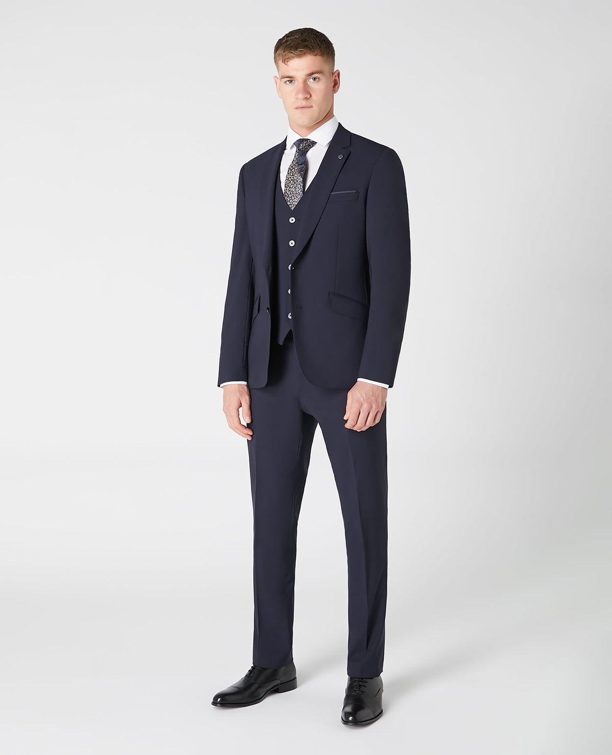 Man wearing a navy Tapered fit wool blend stretch mix and match suit jacket