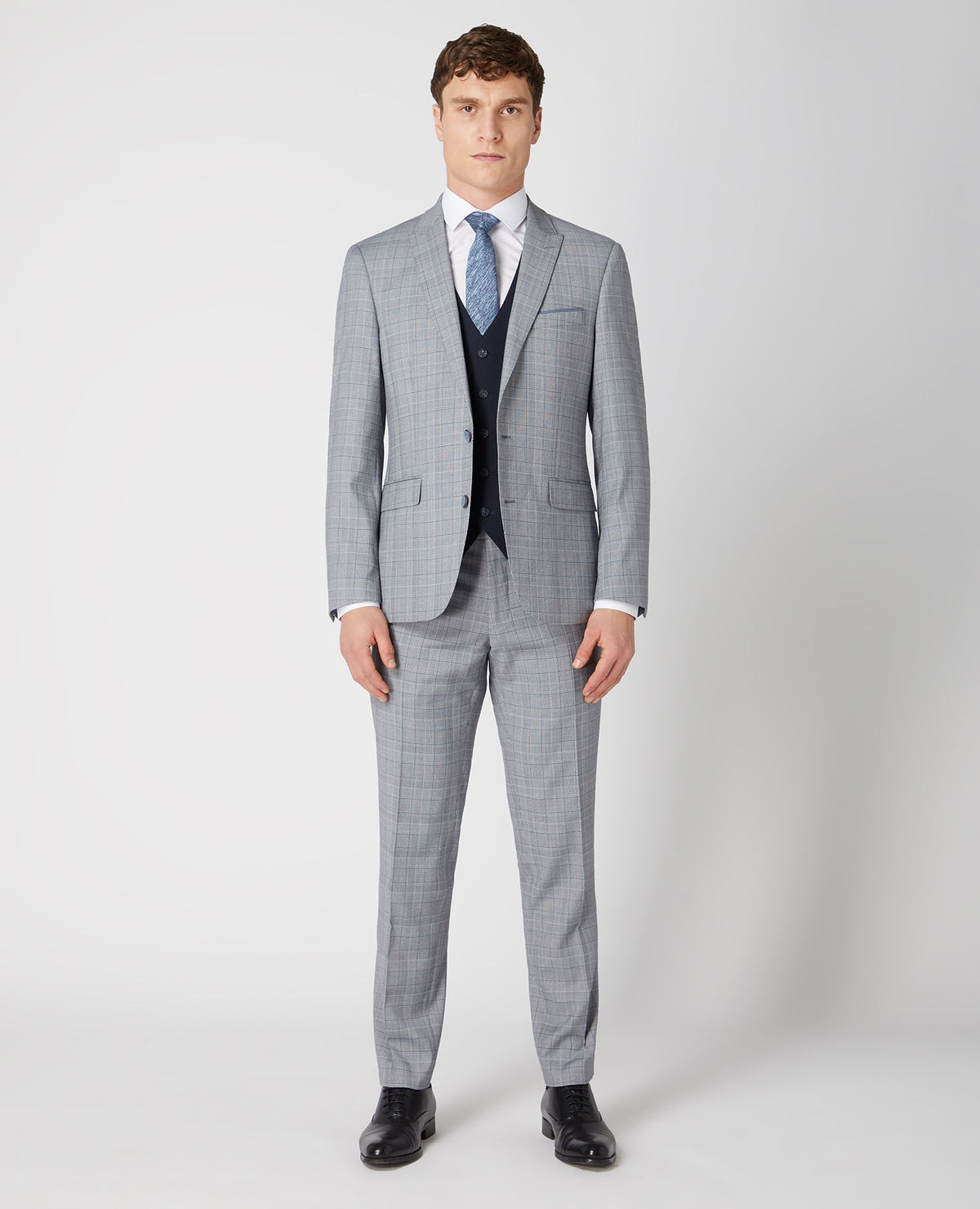 Man wearing a navy Tapered Fit Stretch Waistcoat