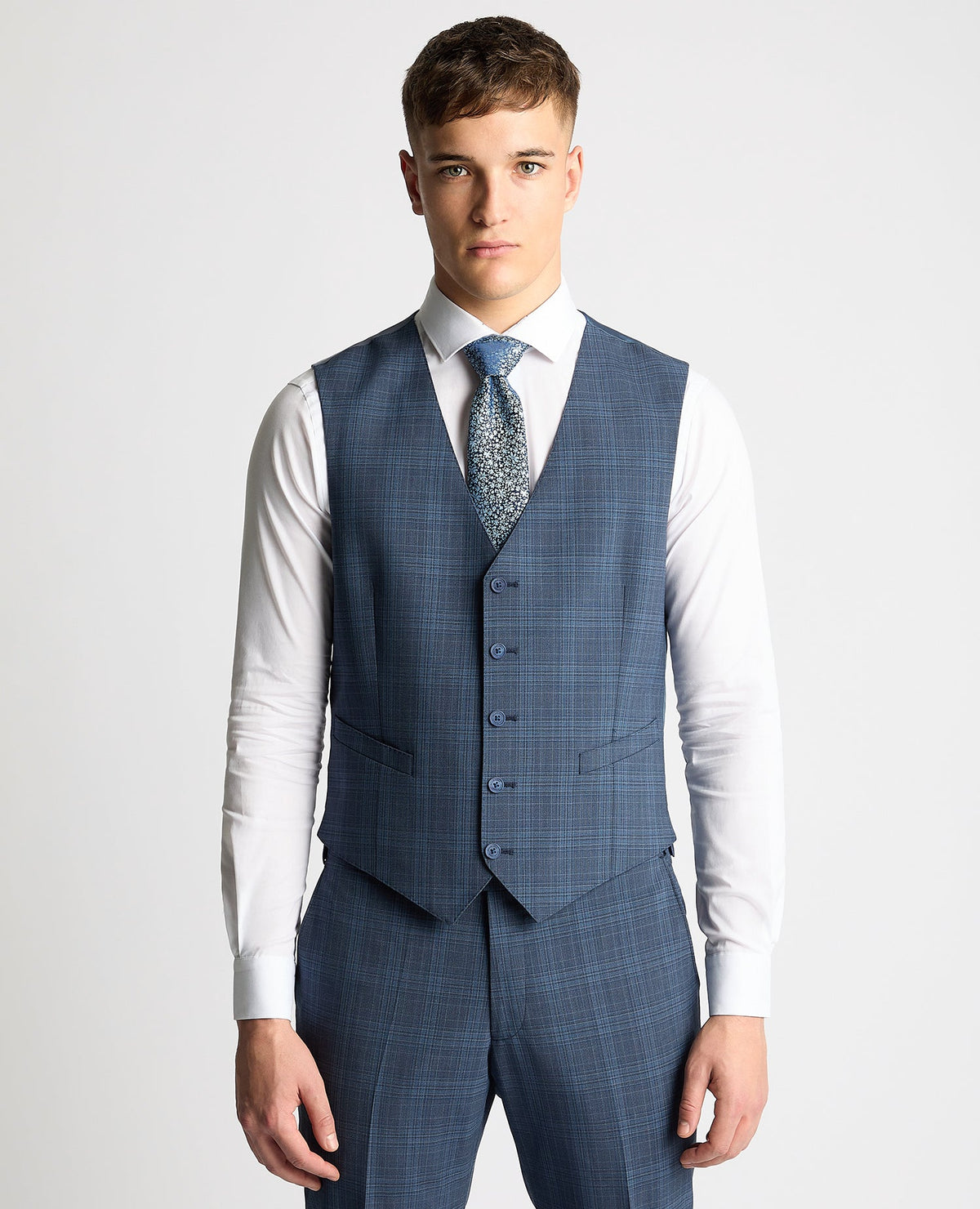 Man wearing a blue Tapered Fit Checked Wool Bend Waistcoat