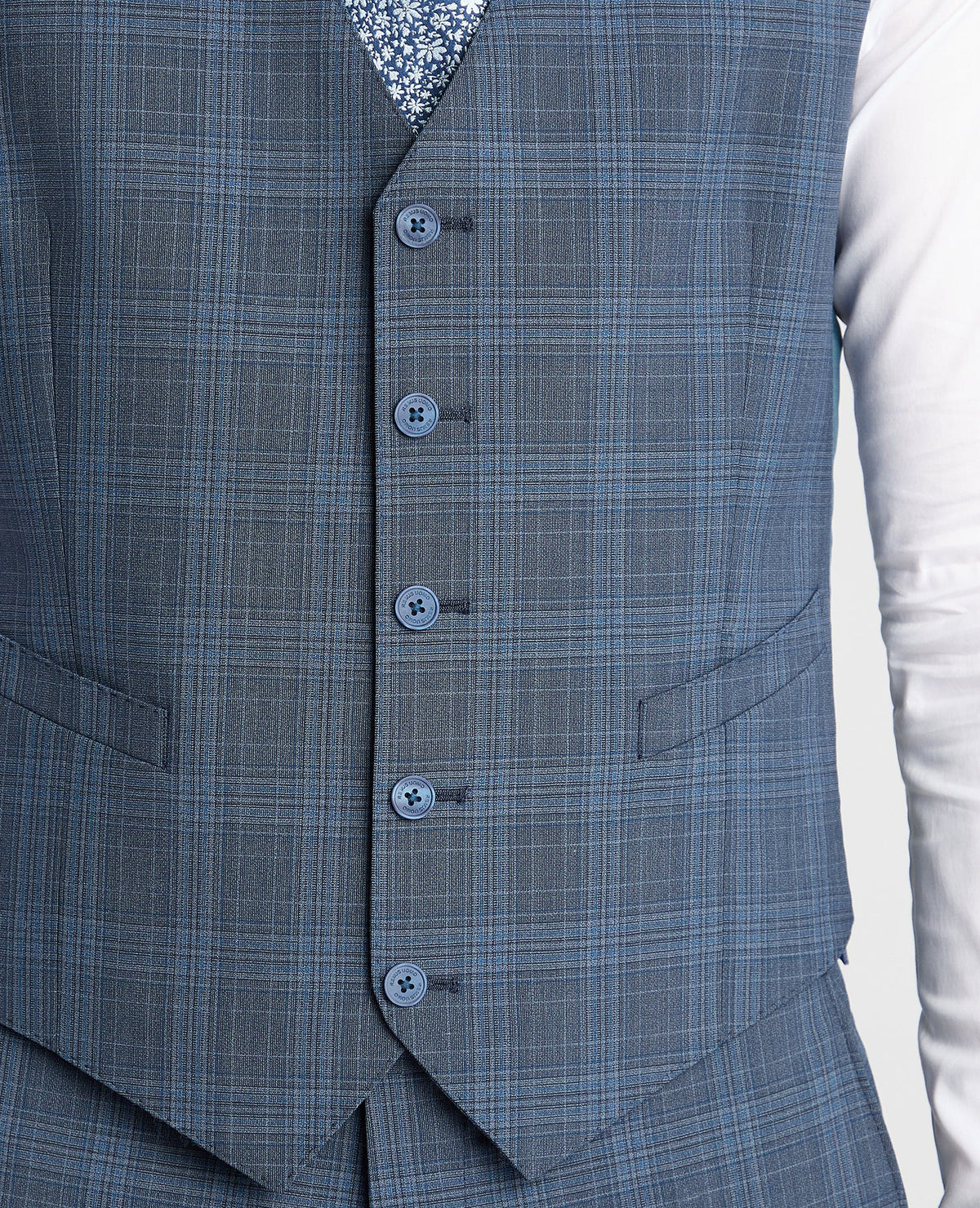Man wearing a blue Tapered Fit Checked Wool Bend Waistcoat