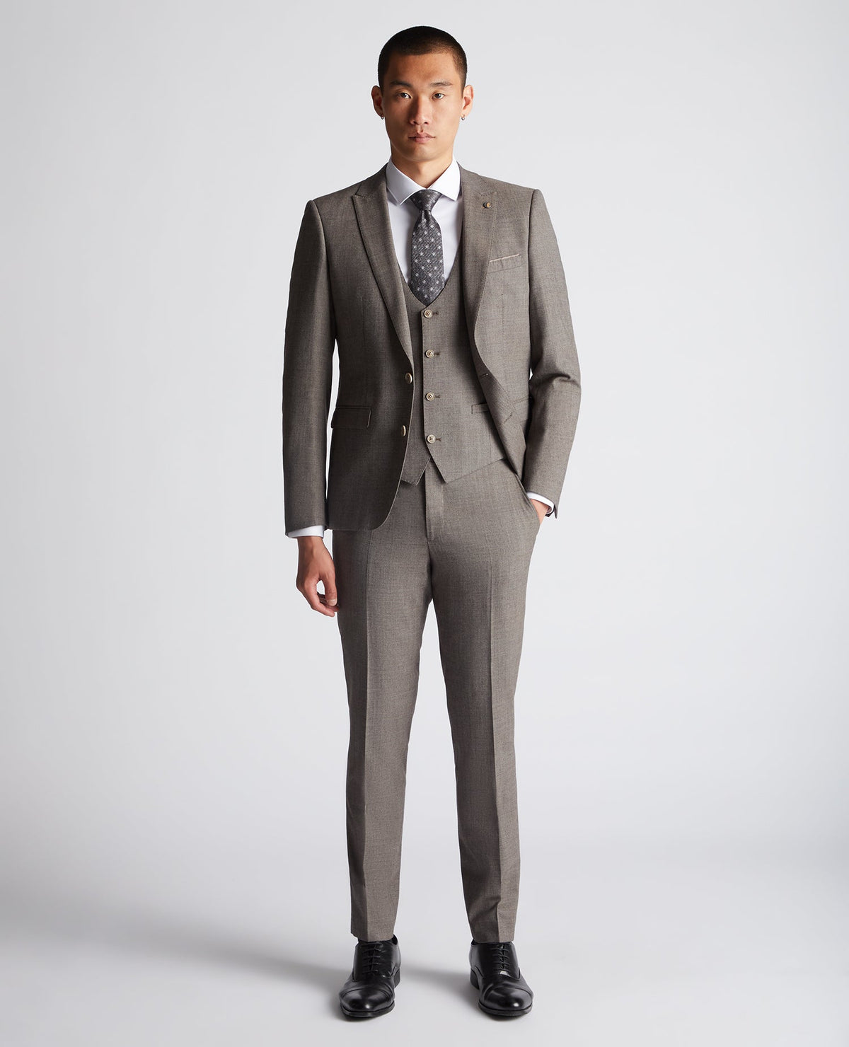 Man wearing a brown X-Slim Fit Wool Blend Mix And Match Suit Waistcoat