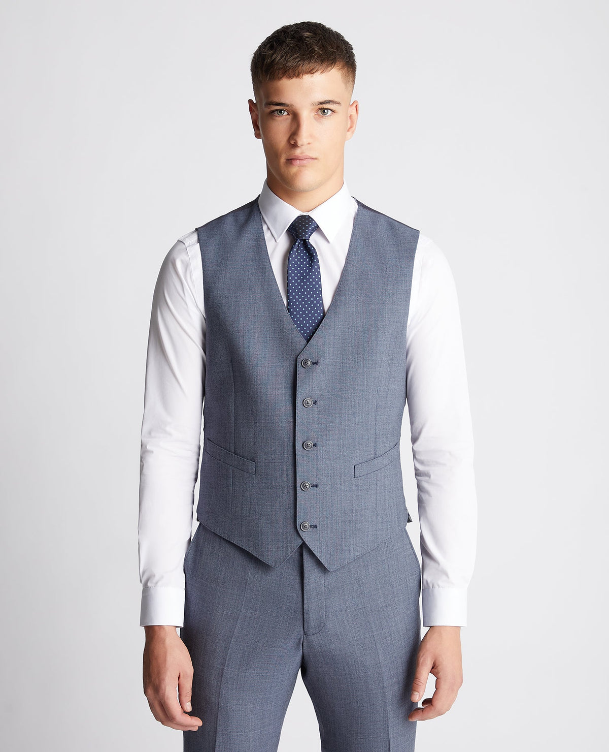 Man wearing a blue Tapered fit wool blend mix and match suit waistcoat