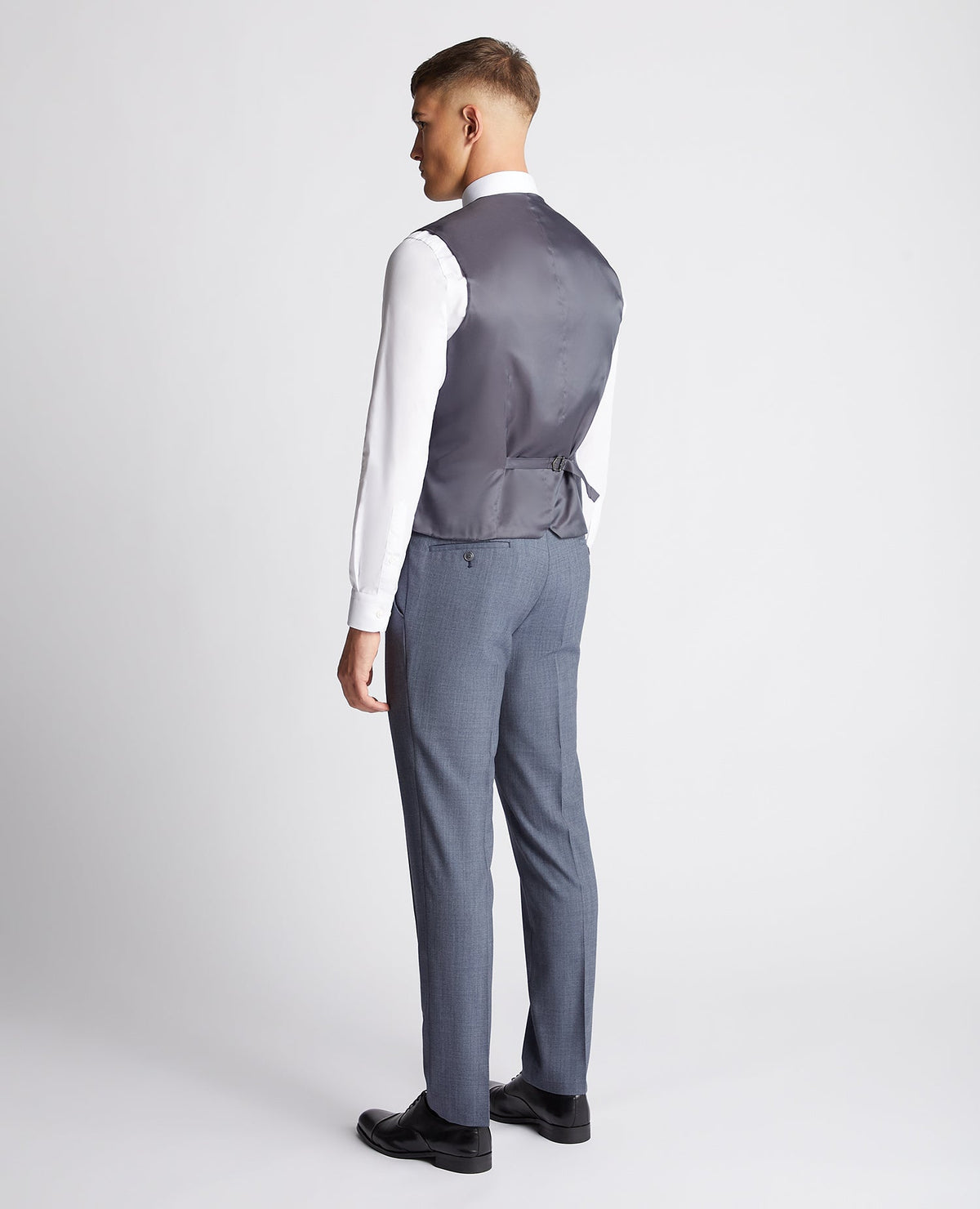 Man wearing a blue Tapered fit wool blend mix and match suit waistcoat