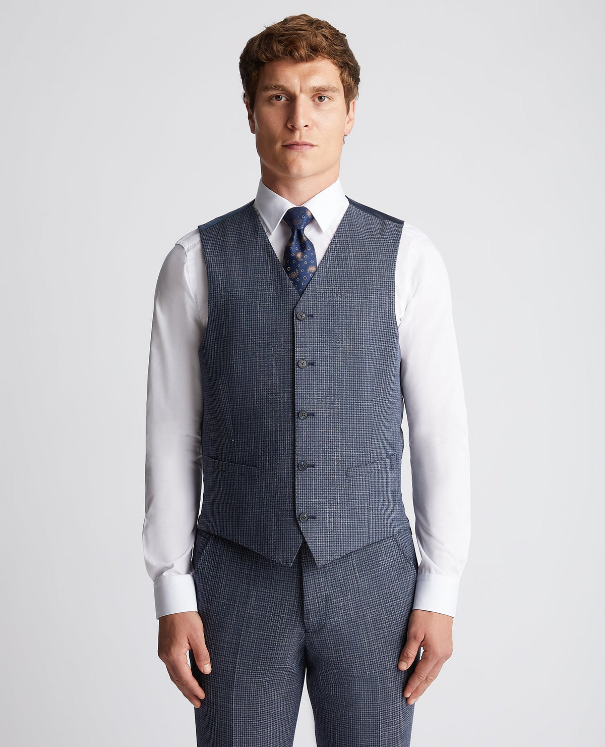 Man wearing a blue Slim Fit Checked Stretch Waistcoat