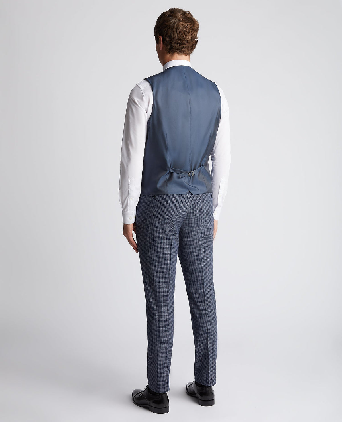 Man wearing a blue Slim Fit Checked Stretch Waistcoat