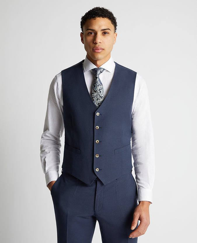 Man wearing a blue Tapered Fit Linen-Blend Waistcoat
