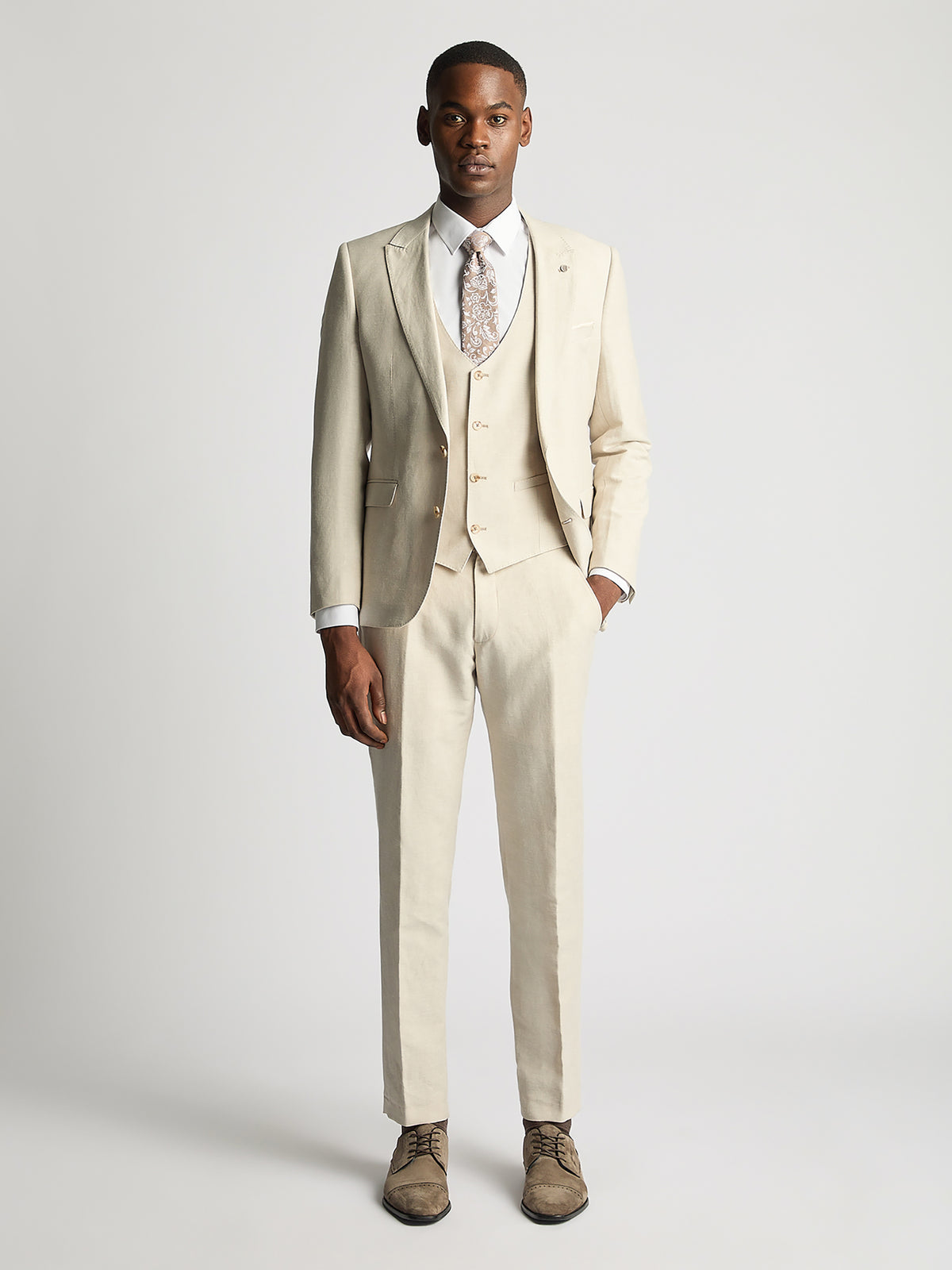 Man wearing a cream suit