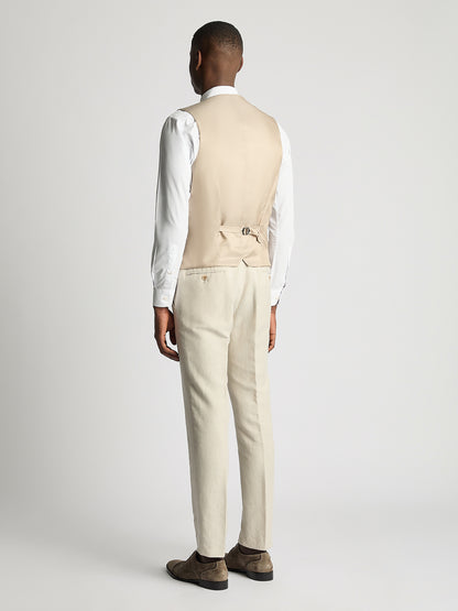 Man wearing a cream suit