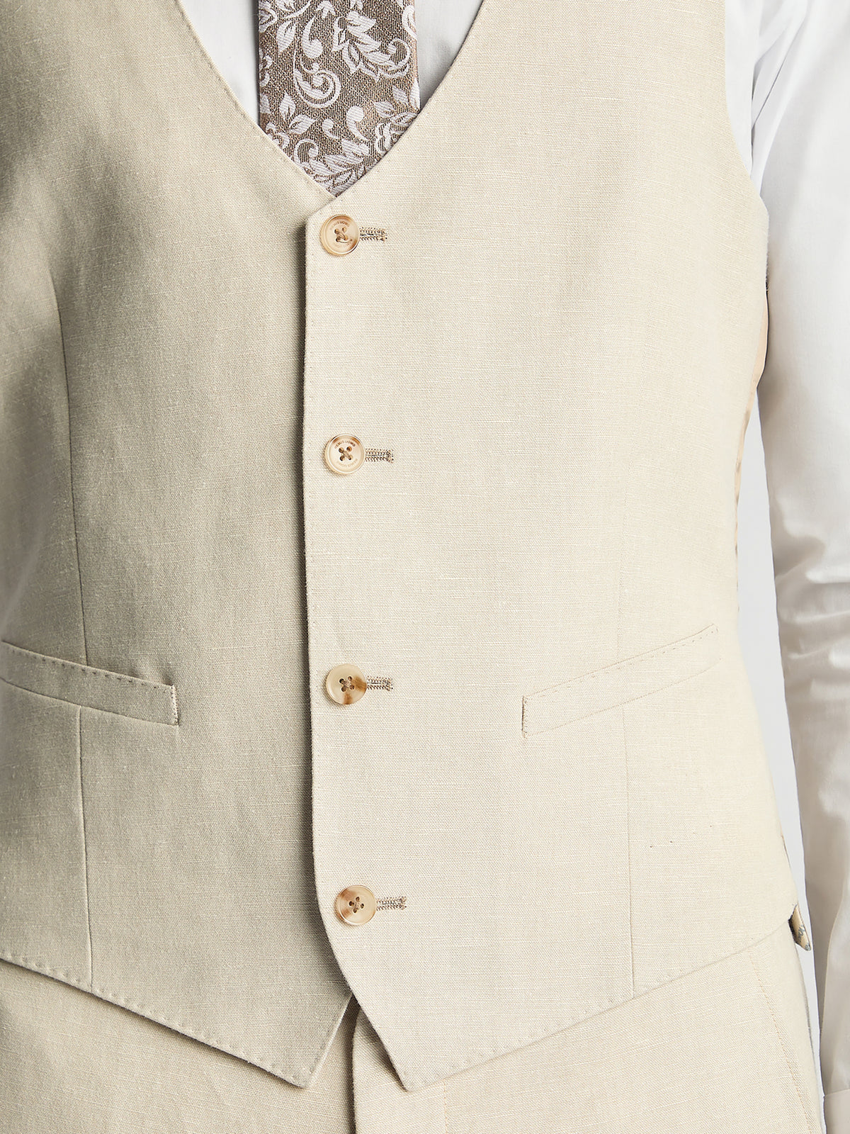 Man wearing a cream suit