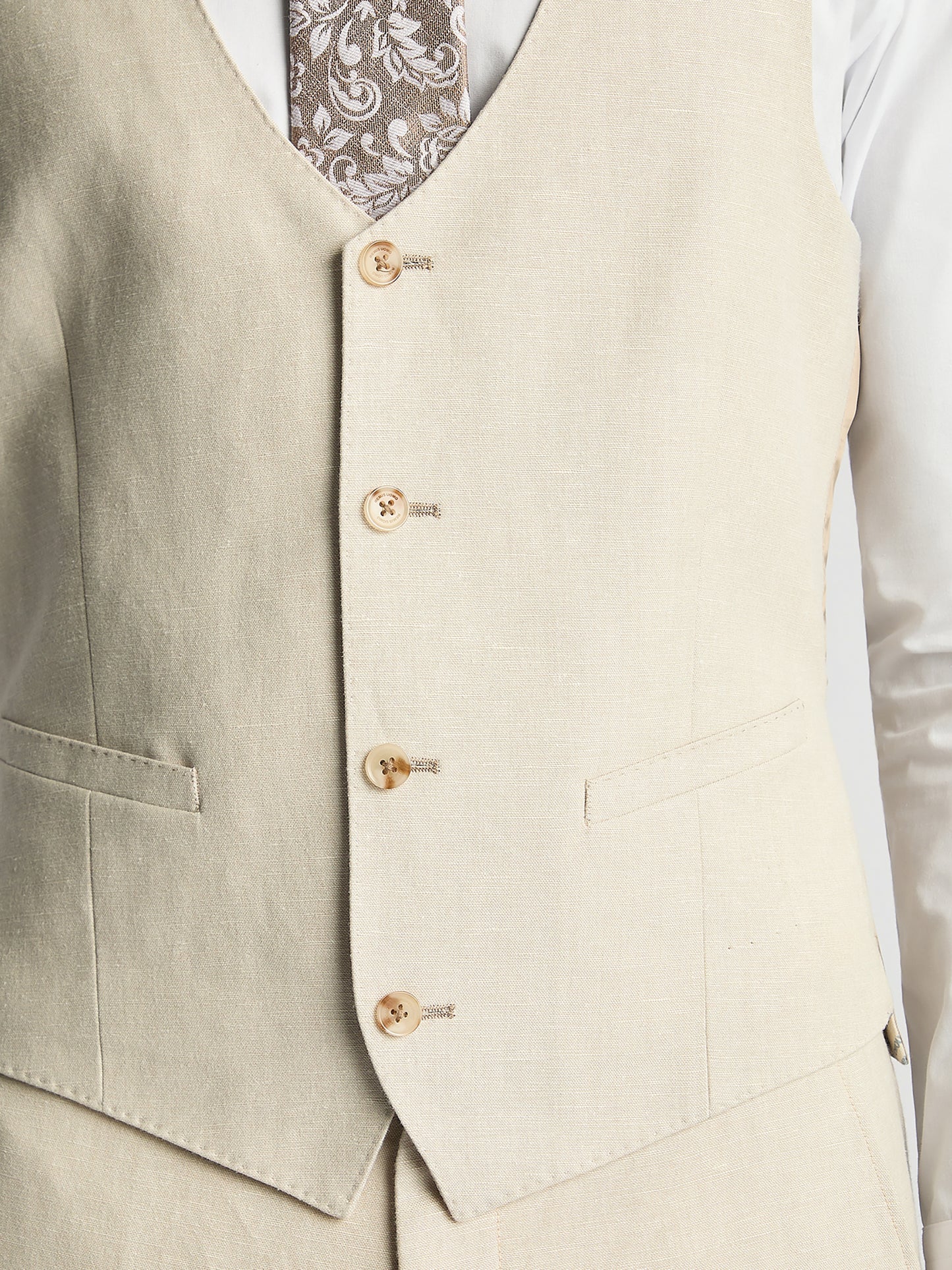 Man wearing a cream suit