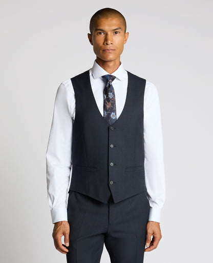 Man wearing a navy Slim Fit Stretch Waistcoat