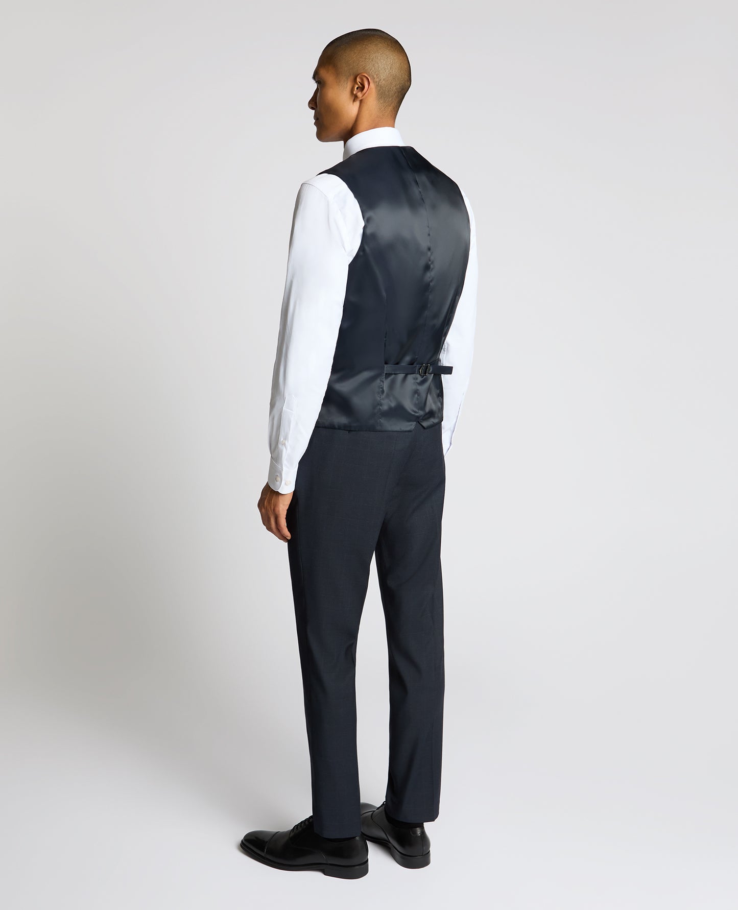Man wearing a navy Slim Fit Stretch Waistcoat