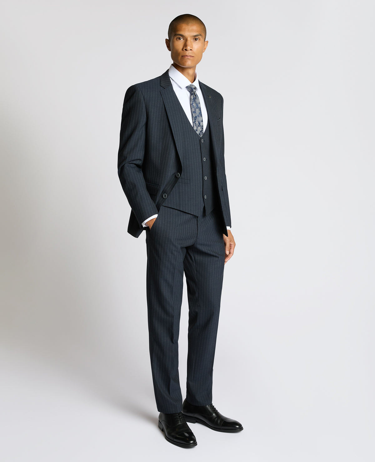 Man wearing a navy Slim Fit Stripe Waistcoat