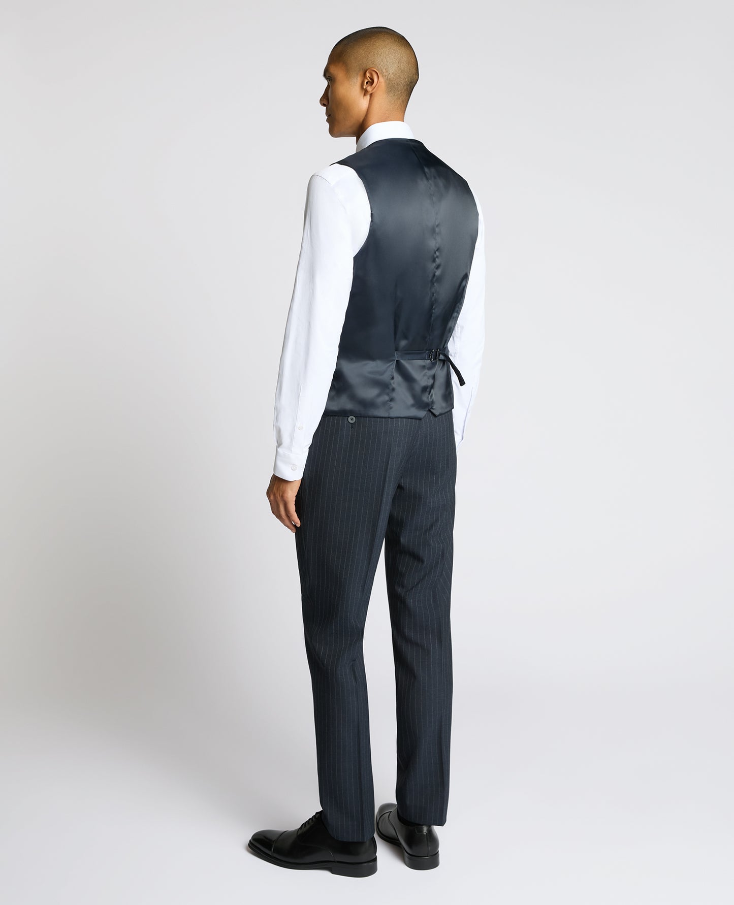 Man wearing a navy Slim Fit Stripe Waistcoat