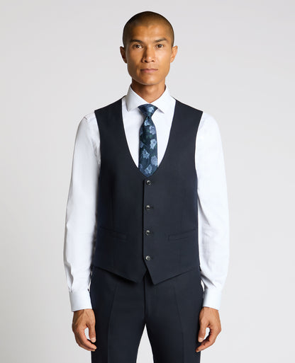 Man wearing a navy Slim Fit Stretch Waistcoat